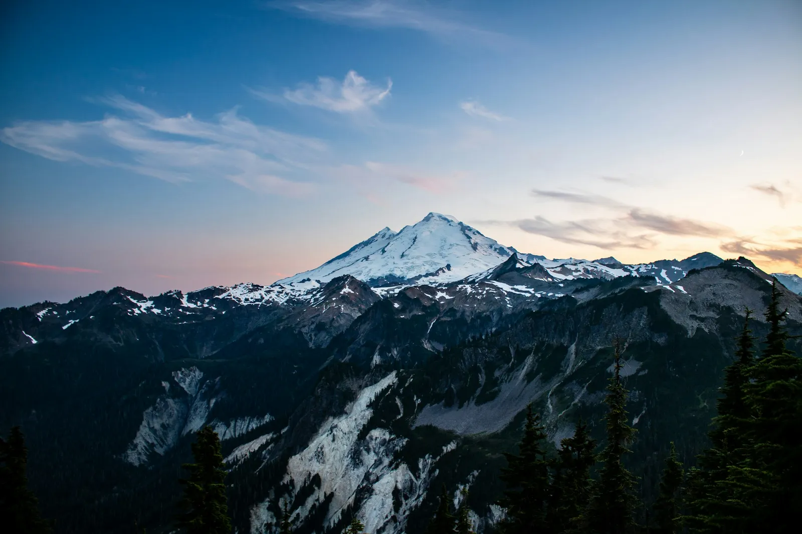 Mt. Baker glowing above the North Cascades at dusk